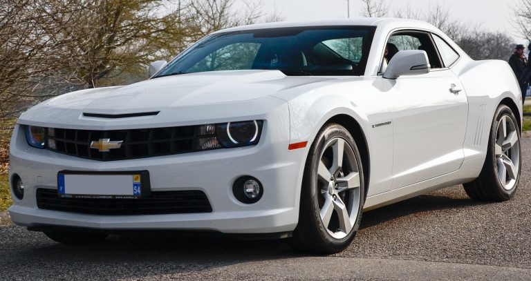 Road Tripping Gas Guzzler: Classic American muscle car on open highway road trip