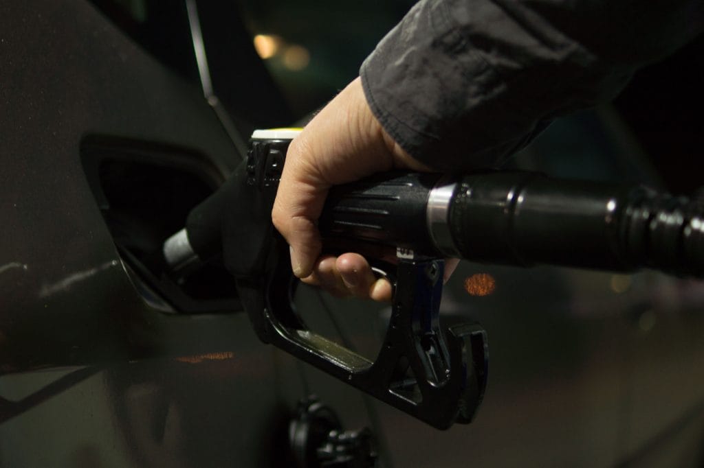 Cost of car ownership: filling up at gas station