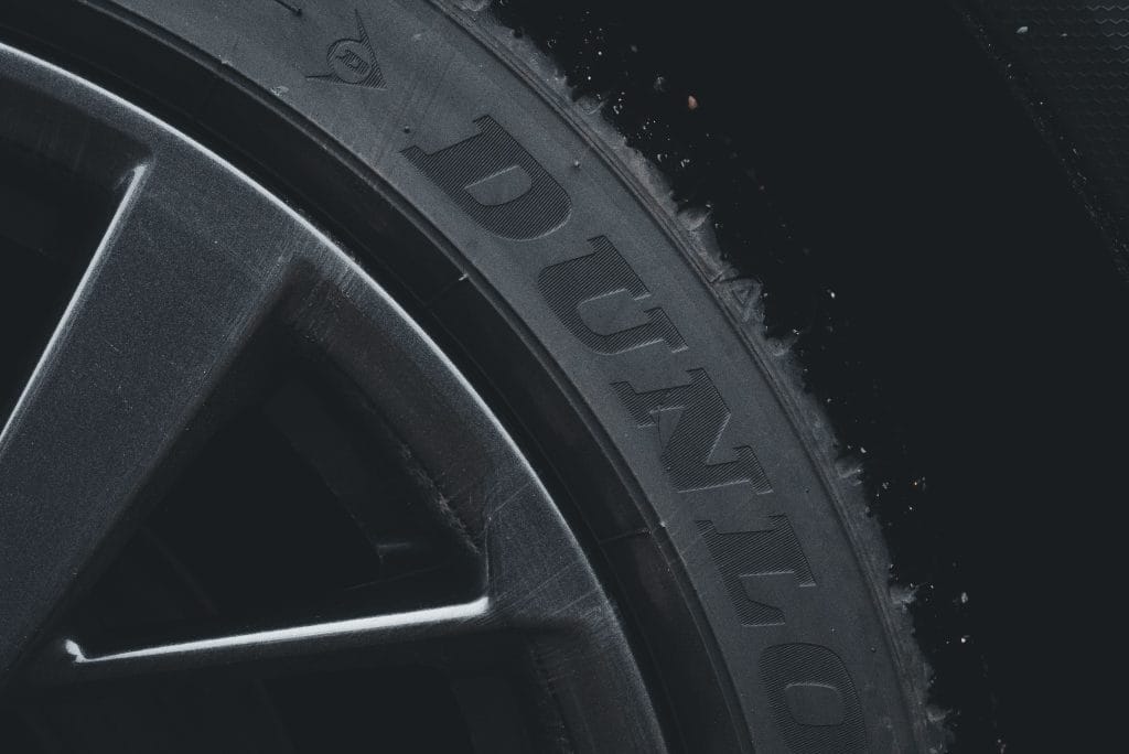 Checking tire tread depth on a used car