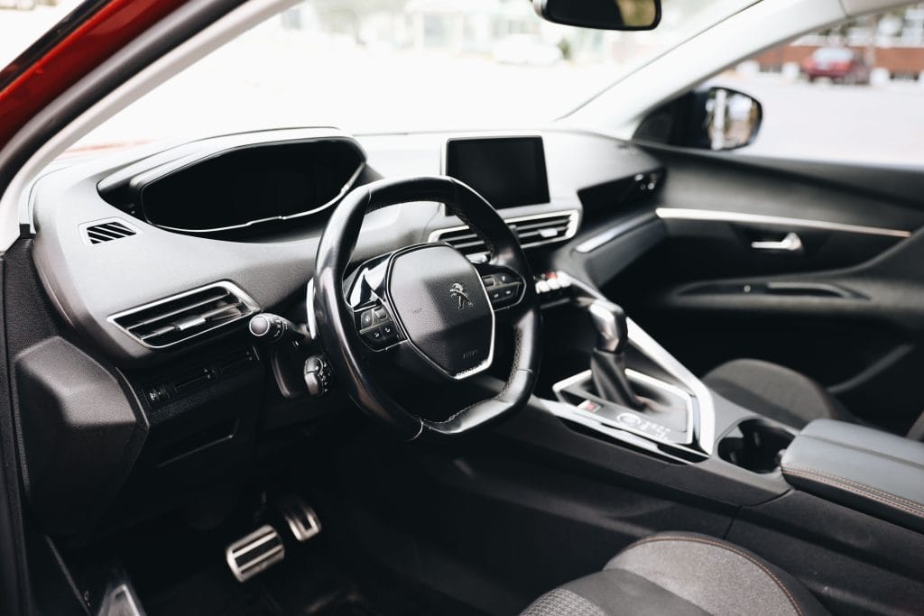 Car dashboard showing safety features important for new driver