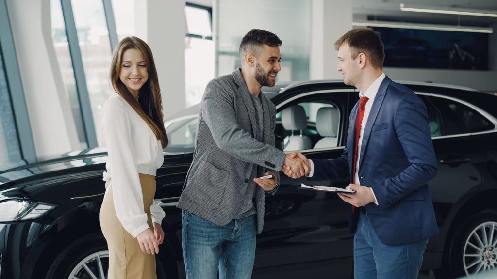 Buyer talking with seller about a used car deal
