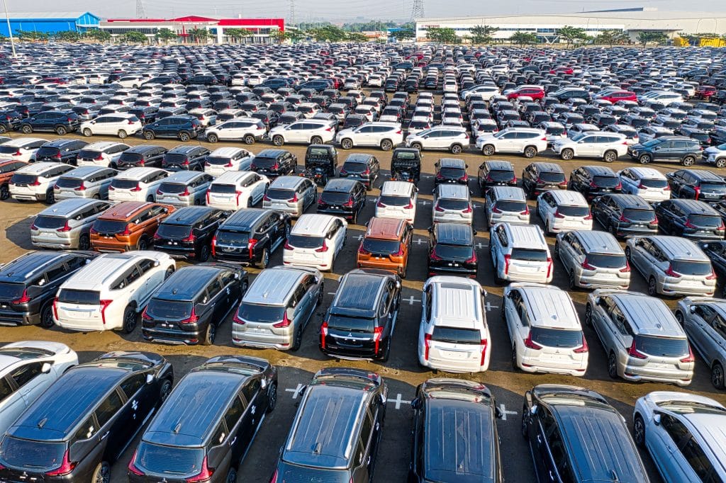 First Car Buying Guide: comparing new and used cars on dealership lot